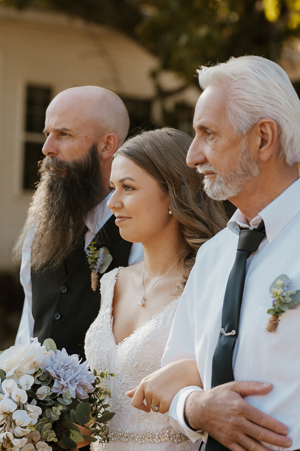 Bride walked down the isle by father and grandfather. She used all Wedding Budget Tips to create her perfect day.