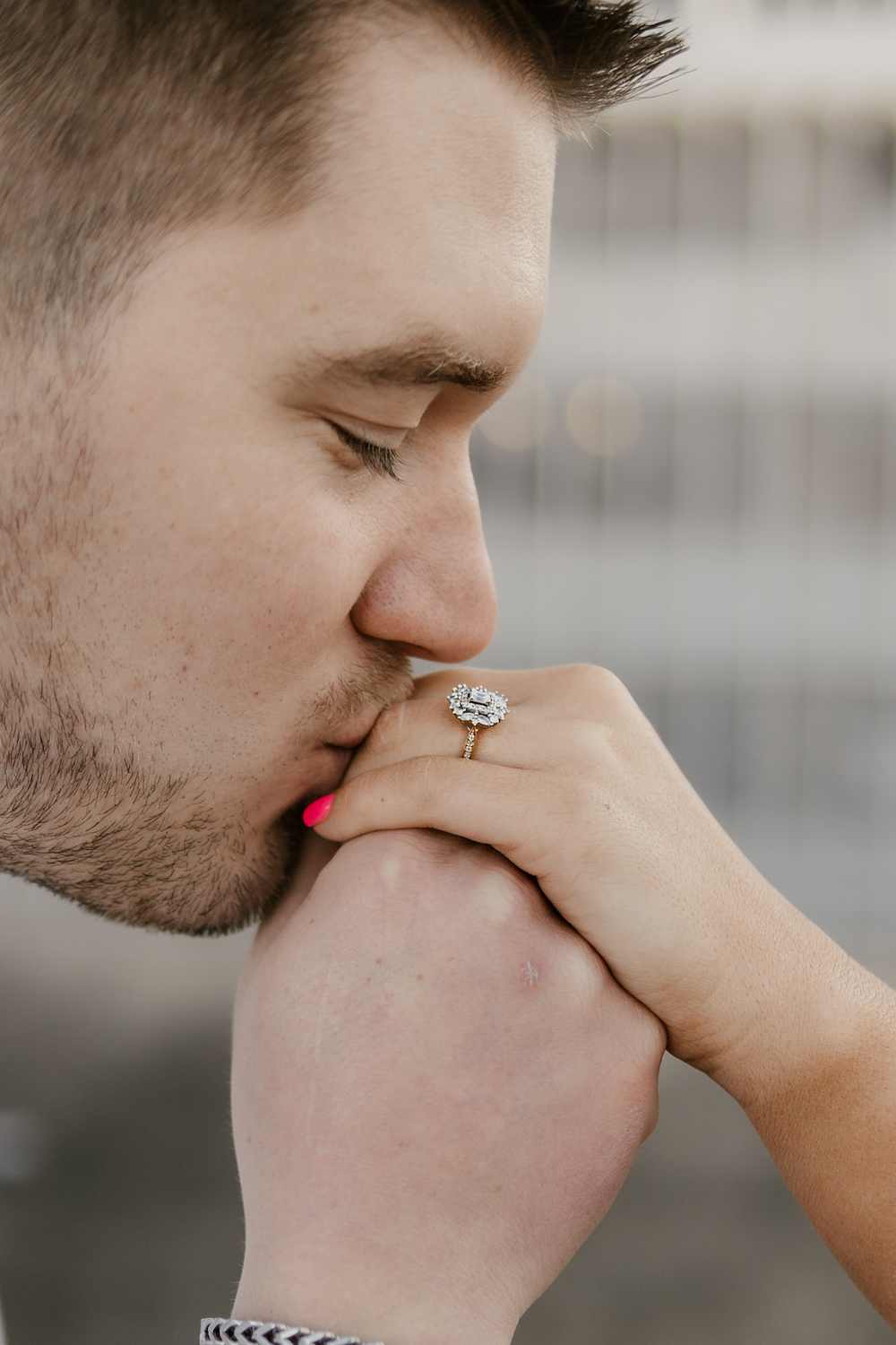 a couple Wedding planning - man kissing ring
